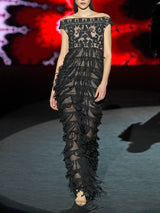 Vestido fiesta realizado en soutache y gasa recortada con escote barca y falda larga recta de Hannibal Laguna