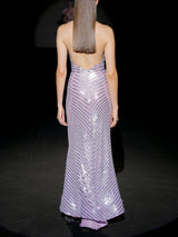 Vestido de fiesta en gasa bordada con lentejuelas, cuerpo con escote halter y falda sirena midi de HANNIBAL LAGUNA.
