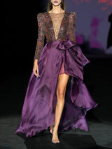 Vestido de fiesta realizado en tatoo bordado, escote V y falda de vuelo asimétrica en organza morada de Hannibal Laguna