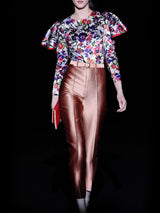 a woman walking down the street with a bag