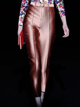 a close up of a person wearing a suit and tie