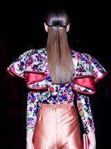 a woman in a dress holding a cell phone