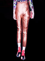 a woman standing on a tennis court holding a racquet