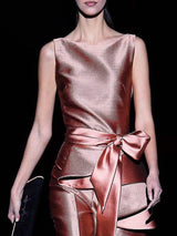 a woman in a dress holding a purse