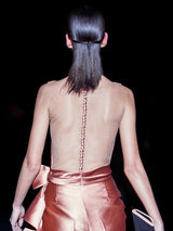 a woman in a bathing suit and a dress