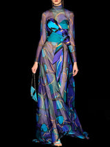 a woman in a dress holding an umbrella