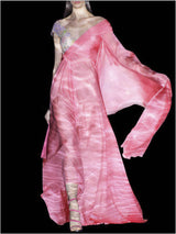 a woman in a pink dress holding a pink purse