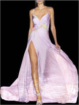 a woman in a white dress holding a pink dress
