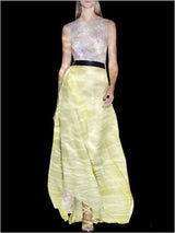 a woman in a white dress holding a purse