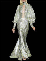 a man and woman standing on a bench