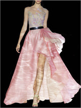 a woman in a pink dress holding a pink umbrella