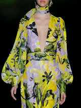 Vestido en gasa devoré estampada con escote en pico, fajín drapeado y falda evasé de Hannibal Laguna