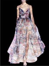 Vestido BELUCI de Hannibal Laguna Couture. Vestido en organza estampada con falda de vuelo, cuerpo drapeado y escote en pico.