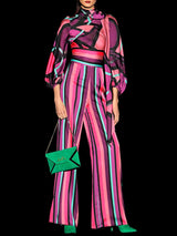 a woman in a pink dress holding a cell phone