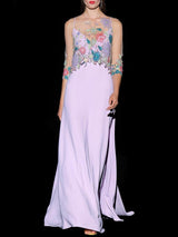 a woman in a white dress holding a tennis racquet