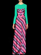 a man in a green shirt with a pink tie