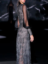Vestido midi entallado bordado con cristales espejo formando ondas, escote caja y mangas XXL en garza negra de Hannibal Laguna