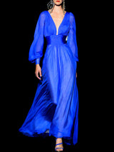 Vestido largo de fiesta en gasa azul royal con escote en V y mangas largas de Hannibal Laguna