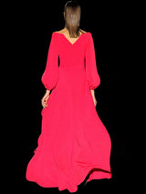 a woman in a pink dress holding a pink umbrella