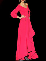 a woman in a pink dress holding a pink frisbee
