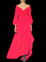 a woman in a red dress holding a cell phone