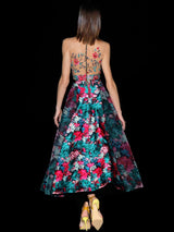 Vestido en crepe rojo y falda asimétrica nesgas de Hannibal Laguna