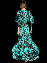 a woman in a green dress holding an umbrella