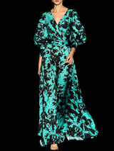 a woman in a green dress holding an umbrella