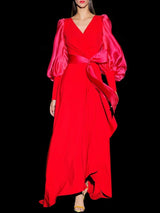 Vestido en crepe rojo con falda asimétrica, cuerpo cruzado y mangas bomber de organza de Hannibal Laguna
