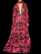 a woman wearing a red dress and a pink dress