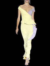 a woman in a white dress holding a surfboard