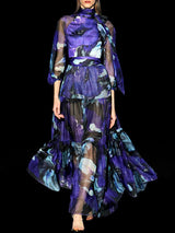 a woman in a purple dress holding a cell phone