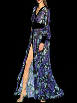 a woman in a dress holding an umbrella