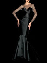 a man walking down a street with a suitcase