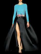 a woman in a blue dress and a black skirt