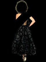 a woman holding a cell phone in her hand