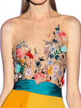 a woman in a dress holding a vase