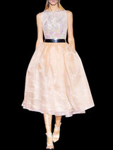 a woman in a white dress holding an umbrella