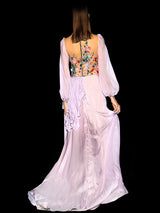 a woman dressed in white is holding a tennis racket