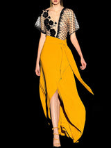 a couple of people walking down a street