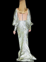 a statue of a man standing next to a statue