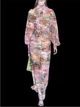 a woman in a pink dress holding a pink umbrella