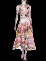a woman in a pink dress holding a pink vase