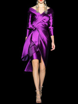 Vestido cocktail en mikado pique morado con falda cruzada y cuerpo drapeado de Hannibal Laguna de Hannibal Laguna