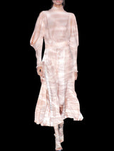 a woman in a white dress holding a cell phone