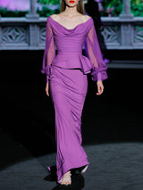 Vestido de fiesta realizado en satín color lavanda ,cuerpo drapeado al bies con escote V, mangas XL y falda sirena de Hannibal Laguna