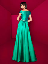 Mod. Cabotier. Hannibal Laguna Couture 2024. Elegante vestido largo con sutil escote en pico y hombros descubiertos.