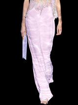 a woman in a pink dress holding a pink umbrella