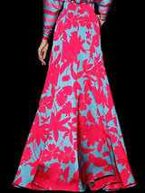 a woman in a red dress holding an umbrella