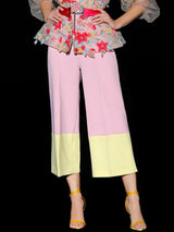 a woman in a pink dress holding a pink umbrella